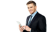 Businessman operating tablet pc