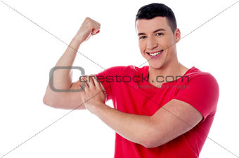 Fitness man showing bicep muscles