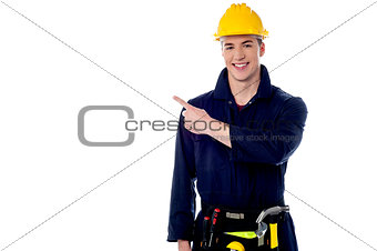 Construction worker pointing away