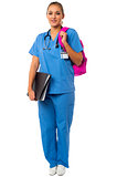 Female doctor posing with backbag