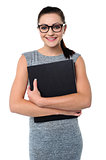 Female assistant holding office file