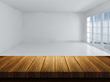 Wooden table with defocussed empty room image