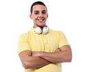 Fashion guy with headphones around his neck
