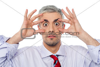 businessman with eyes wide open