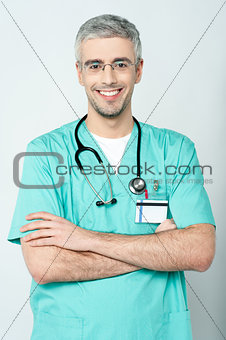 Smiling physician, arms crossed