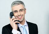 Businessman attending phone call