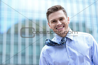 Smiling handsome young businessman