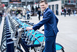 Young businessman with a bicycle