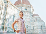 Portrait of happy young woman standing in front of cattedrale di