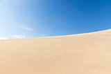 Blue sky and sand dunes. Sunny day. 