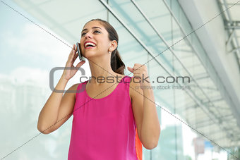 Young Woman On The Phone Smiling For Joy