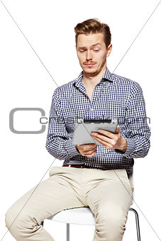 Man looks on tablet