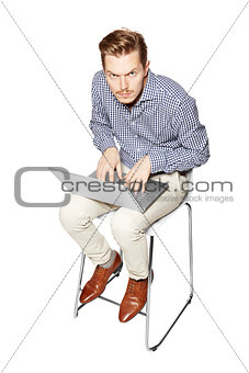 Young man working hard on a computer