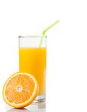 glass of orange juice with straw and half orange with space for text
