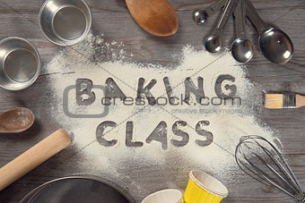 Word baking class written in white flour 