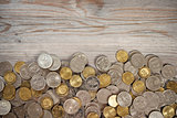 Top view coins on old wooden desk