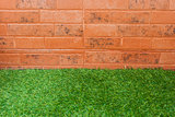 Grass and brick wall background