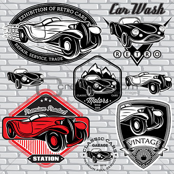 set of emblems with retro car on wall
