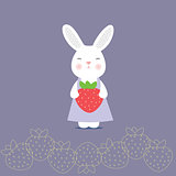 Cute bunny holding a strawberry