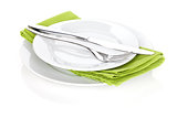 Silverware or flatware set of fork and knife over plates