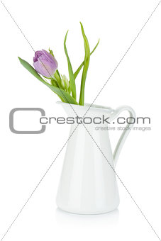 Pink tulip in metal pitcher