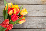 Fresh colorful tulips bouquet with ribbon and bow
