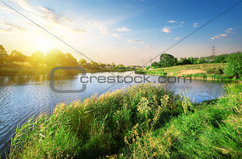 Bright sunset over river