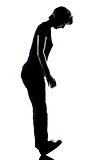 one young teenager boy or gir standing balancing on heels silhou