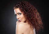 Beautiful woman with red curly hair