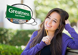 Young Woman with Thought Bubble of Greatness Green Road Sign 