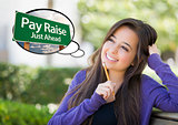 Young Woman with Thought Bubble of Pay Raise Green Sign 