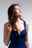 Woman in Blue Dress and Long Brown Hair Looking