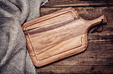 Empty vintage cutting board on old wooden background