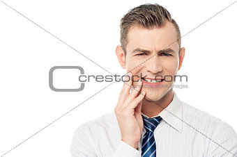 Male executive with toothache