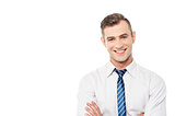 Smiling corporate man with folded arms