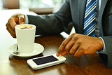 Man using mobile phone in the coffee shop