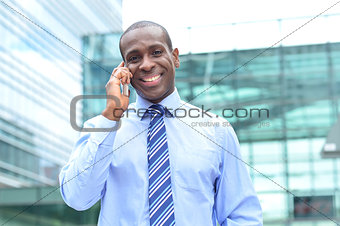 Male executive talking on his mobile phone