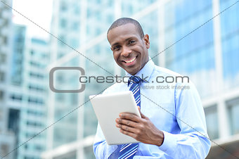 Middle aged businessman using a tablet