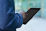 Corporate man working with a digital tablet