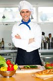 Male chef chopping vegetables in table