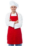 Male chef standing with arms crossed