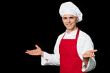 Young male chef welcoming his guests