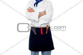Male chef with kitchen utensils
