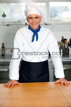 Handsome young chef posing in uniform