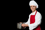 Male chef holding empty vessels