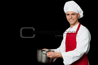 Male chef holding empty vessels