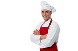 Smiling male chef on a white background