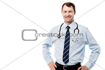 Happy male doctor hold hands on hips