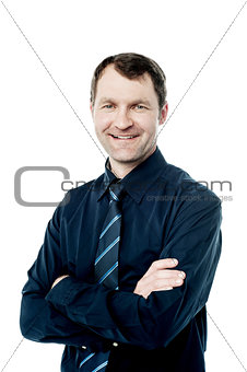 Handsome corporate man with folded arms
