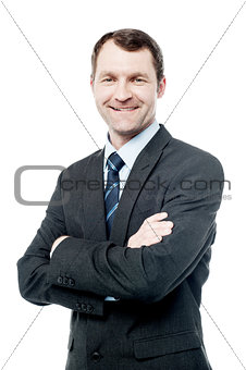 Handsome businessman with folded arms